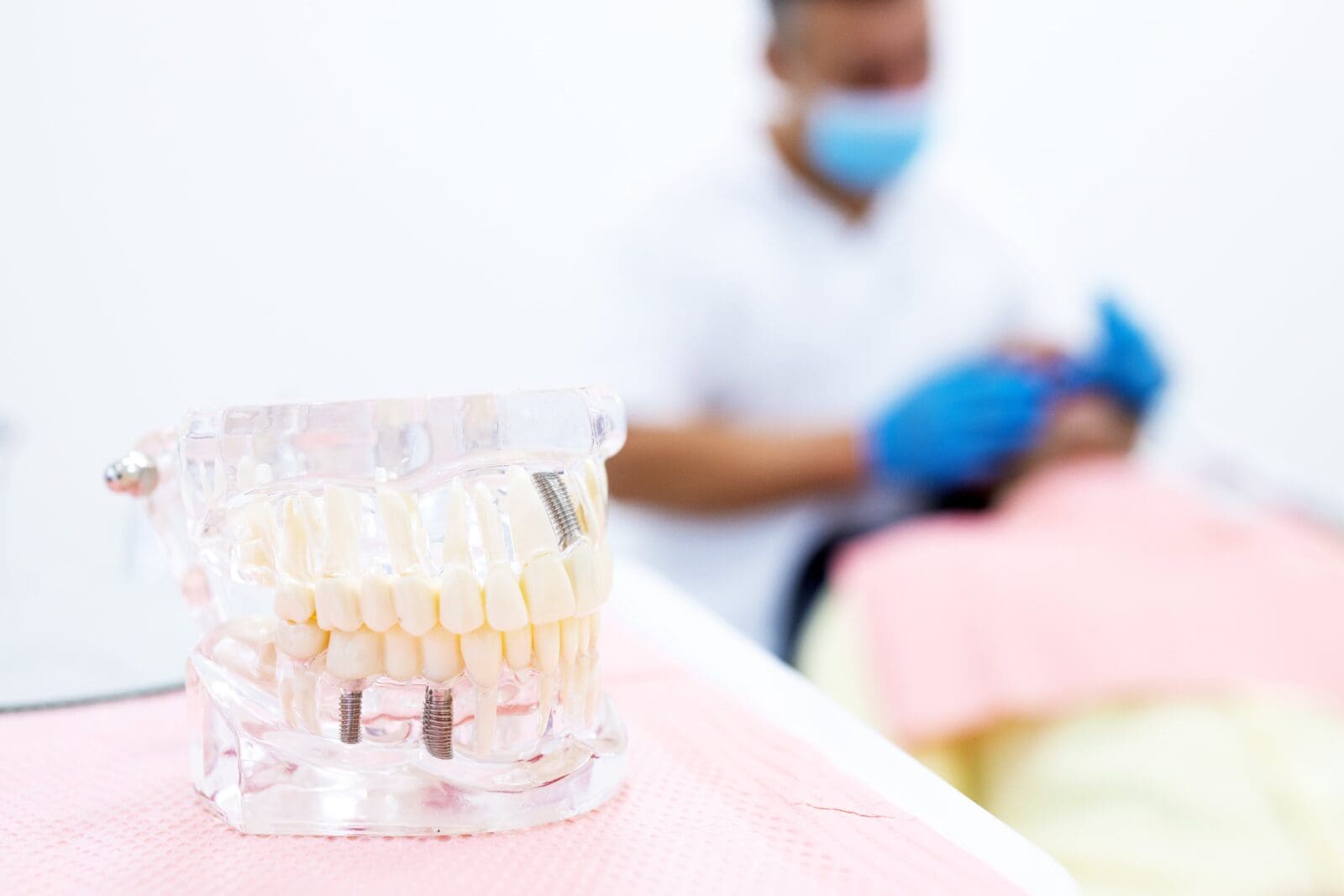 dentist examining male patient with tools in dental clinic