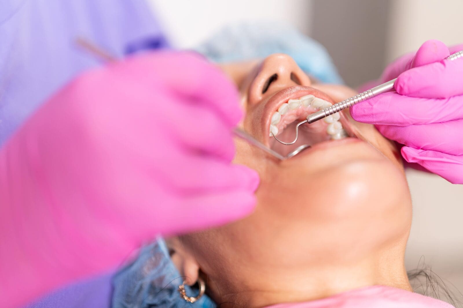 Dentist Performing a Procedure with Dental Equipment